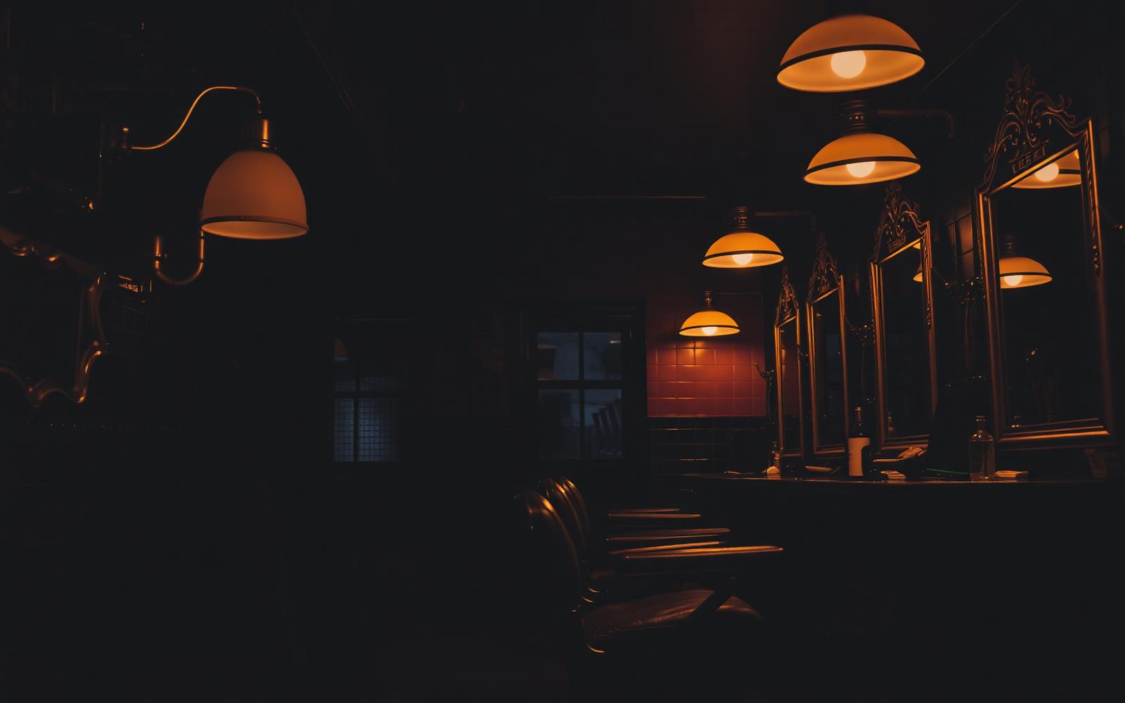 Short Cuts Barbershop interior at dusk
